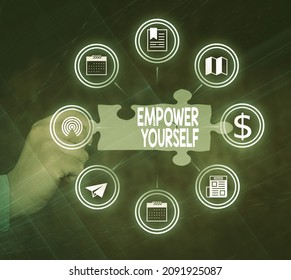Text sign showing Empower Yourself. Business approach taking control of life setting goals positive choices Hand Holding Jigsaw Puzzle Piece Unlocking New Futuristic Technologies.