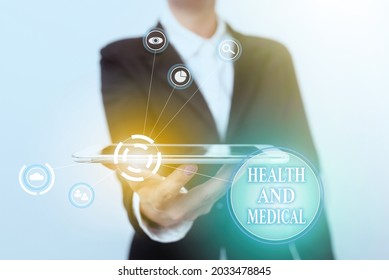 Text Sign Showing Health And Medical. Business Idea Study And Investigation Of Physical And Mental Wellbeing Lady In Suit Presenting Mobile Device With Futuristic Interface Tech.