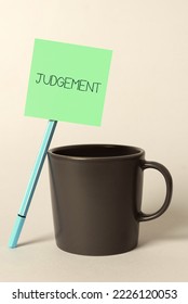 Text sign showing Judgement. Concept meaning process of forming an evaluation by discerning and comparing - Shutterstock ID 2226120053