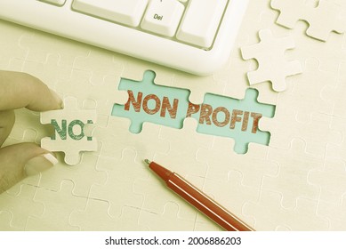 Text Sign Showing Non Profit. Business Showcase An Activity Not Making Or Conducted Primarily For A Profit Building An Unfinished White Jigsaw Pattern Puzzle With Missing Last Piece