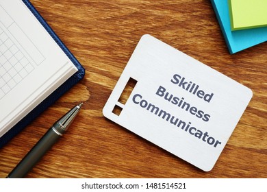 Text sign showing Skilled Business Communicator. The text is written on a small wooden board with exclamation mark silhouette. There are notebook, pen, colored papers on the photo. - Shutterstock ID 1481514521