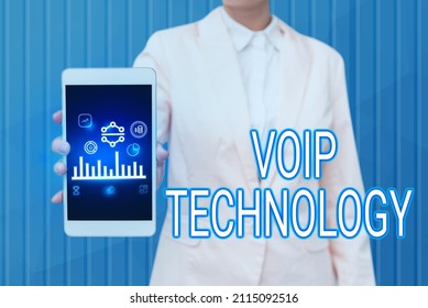 Text sign showing Voip Technology. Business overview use Internet as the transmission medium for telephone calls Lady Pressing Screen Of Mobile Phone Showing The Futuristic Technology