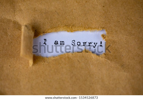 The\
text, i am sorry, appears behind torn brown\
paper