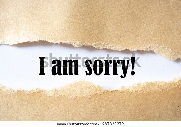 The\
text, I am sorry, appears behind torn brown\
paper