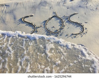 Text Sos Help On The Sand On The Beach