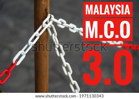 Text spelling 'Malaysia MCO 3.0' on blurred lock chains background. Movement Control Order. Covid 19 prevention.  Stock photo © 