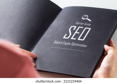 Text " Starter Guide SEO Search Engine Optimization" on page of black book. - Shutterstock ID 2121219404