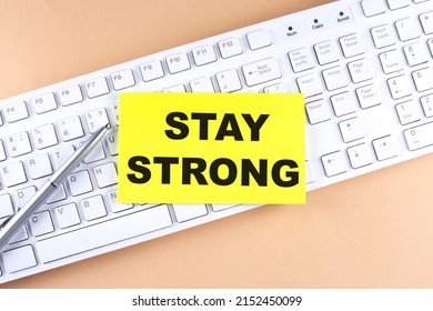 Text STAY STRONG Text On Sticky On Keyboard, Business Concept