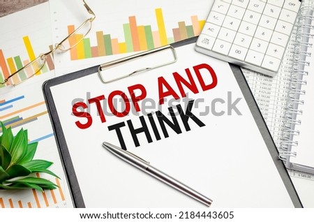 Text STOP AND THINK concept on chart background