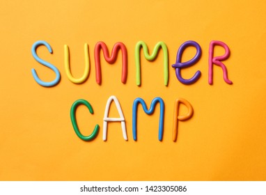 Text SUMMER CAMP Made Of Modelling Clay On Color Background, Flat Lay