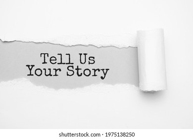 The text TELL US YOUR STORY appearing behind torn brown paper - Shutterstock ID 1975138250