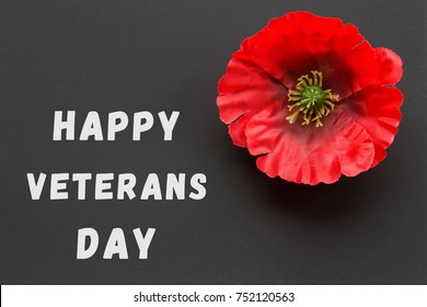 The Text Thank You Veterans Written In A Chalkboard And Red Poppy On A Rustic Wooden Background