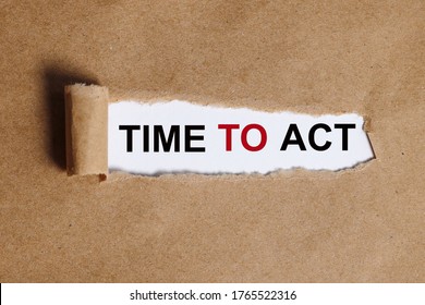 The text Time to act appearing behind torn paper.