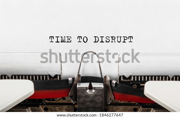 Text Time to\
Disrupt typed on retro\
typewriter.