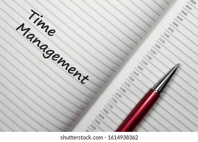 Text time management on notebook with red pen on white background. Top view with copy space for input the text.