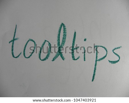 Text tooltips hand written by green oil pastel on white color paper