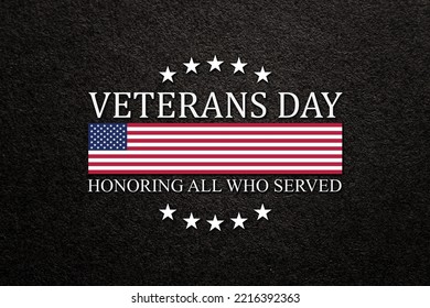 Text Veterans Day Honoring All Who Served on black textured background. American holiday typography poster.