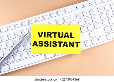 Text VIRTUAL ASSISTANT text on sticky on keyboard, business concept