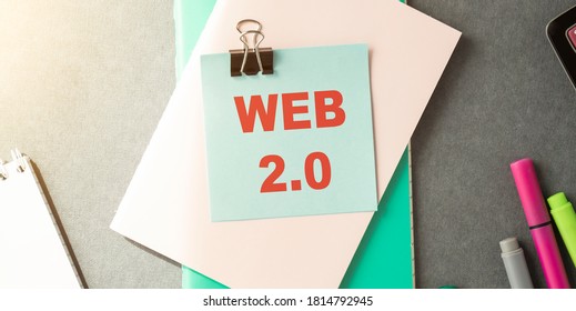 Text web 2.0 hand written by brown oil pastel on blue color paper