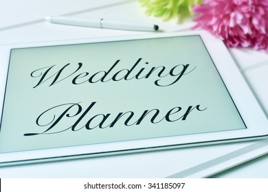 The Text Wedding Planner In The Screen Of A Tablet Computer