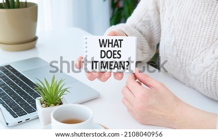 Text What Does It Means question. Concept meaning asking someone about meaning you do not understand woman holds empty paper