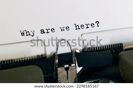 Text Why are we here typed on retro typewriter