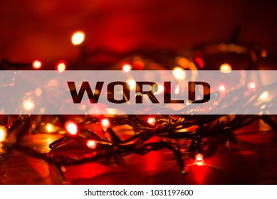 Text with the word World as concept on lights background with bokeh effect. Conceptual.