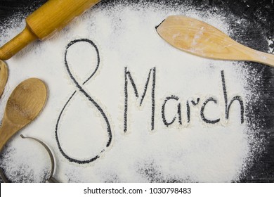 Text written on scattered flour. 8 march concept - Powered by Shutterstock