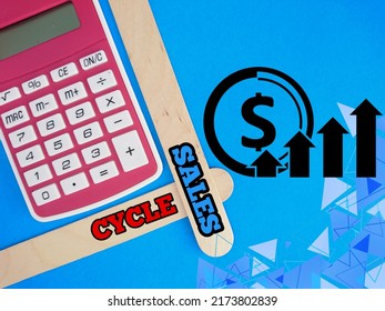 Text Written Sales Cycle At Ice Cream Stick, Icon And Calculator On Blue Background 