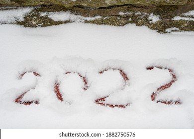 Text written in the snow, 2022. Cadaveric plan. Happy New Year greetings concept - Shutterstock ID 1882750576