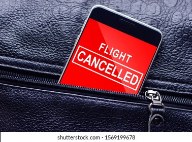 Text Your Flight Cancelled On Cell Phone Screen From The Leather Bag 