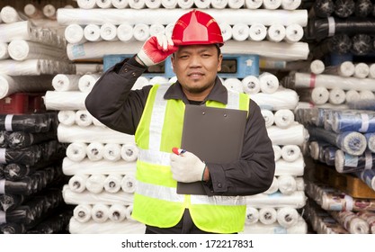 Textile Factory Labor Standing  In Warehouse Fabrics