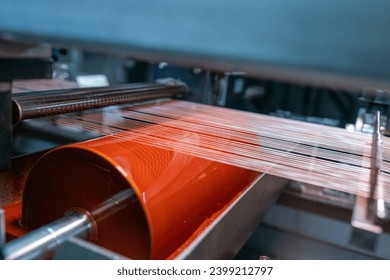 Textile factory, Textile machine,Variation visible as thread color changes in rope dyeing machine for making denim fabric. - Powered by Shutterstock