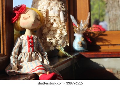 Textile handmade doll with blond hair