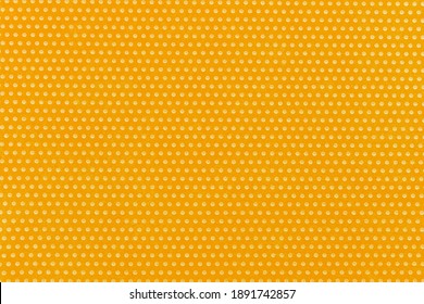 Textile homogeneous background color yellow in white fine polka dots, horizontal pattern. View from above. Emotionally warm sunny mustard sandy saturated.