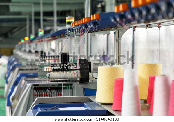 Textile\
industry with knitting machines in\
factory