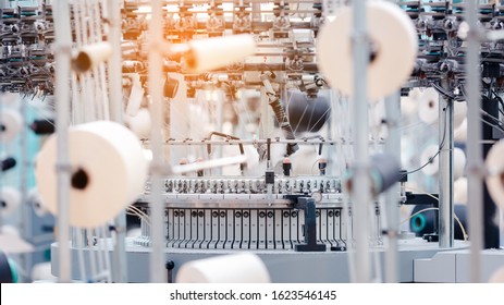 Textile Manufacturing. Circular knitted fabric. Textile factory in spinning production line and a rotating machinery and equipment production company. Clothing industry. Manufacturing textile fabrics. - Powered by Shutterstock