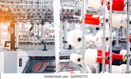 Textile Manufacturing. Circular knitted fabric. Textile factory in spinning production line and a rotating machinery and equipment production company. Clothing industry. Manufacturing textile fabrics. - Powered by Shutterstock