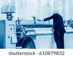 Textile mill workshop interior, working female workers.