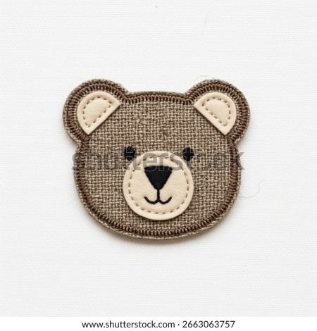 textile patch in the form of a bear on a white background