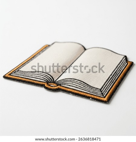 Textile patch in the form of a book on a white background
