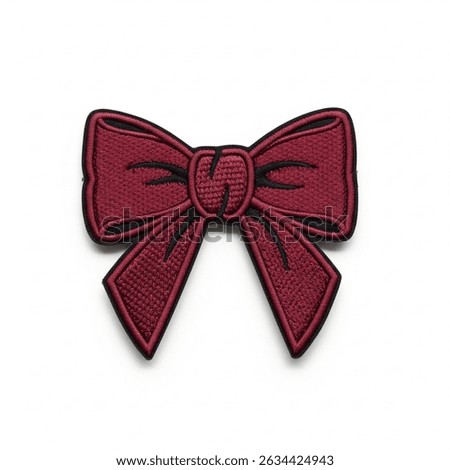 textile patch in the form of a bow on a white background
