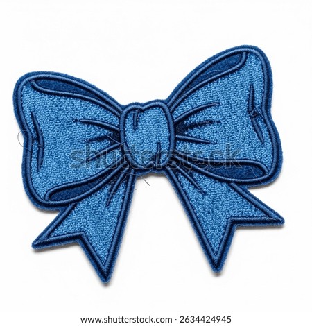 textile patch in the form of a bow on a white background