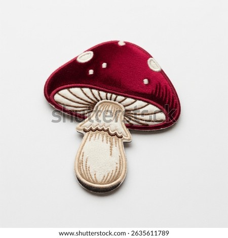 textile patch in the form of a mushroom on a white background