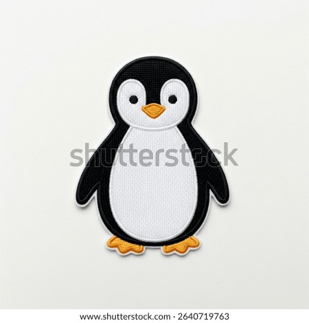 textile patch in the form of a penguin on a white background