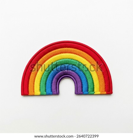 textile patch in the form of a rainbow on a white background