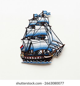 textile patch in the form of a sailing ship on a white background