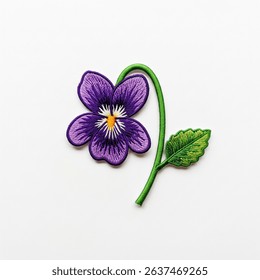 Textile patch in the form of a violet flower on a white background