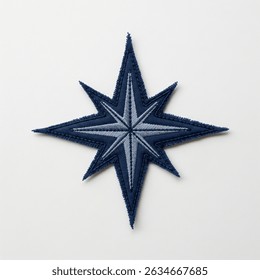 Textile patch in the form of a wind rose star on a white background