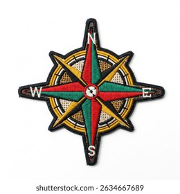 Textile patch in the form of a wind rose star on a white background